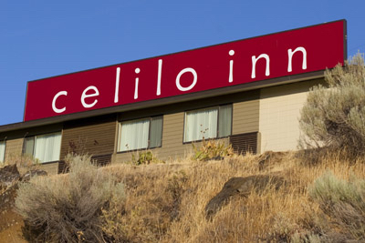 red sign with Celilo inn printed