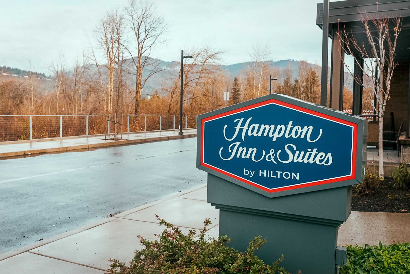 sign with text for Hampton Inn & Suites by Hilton