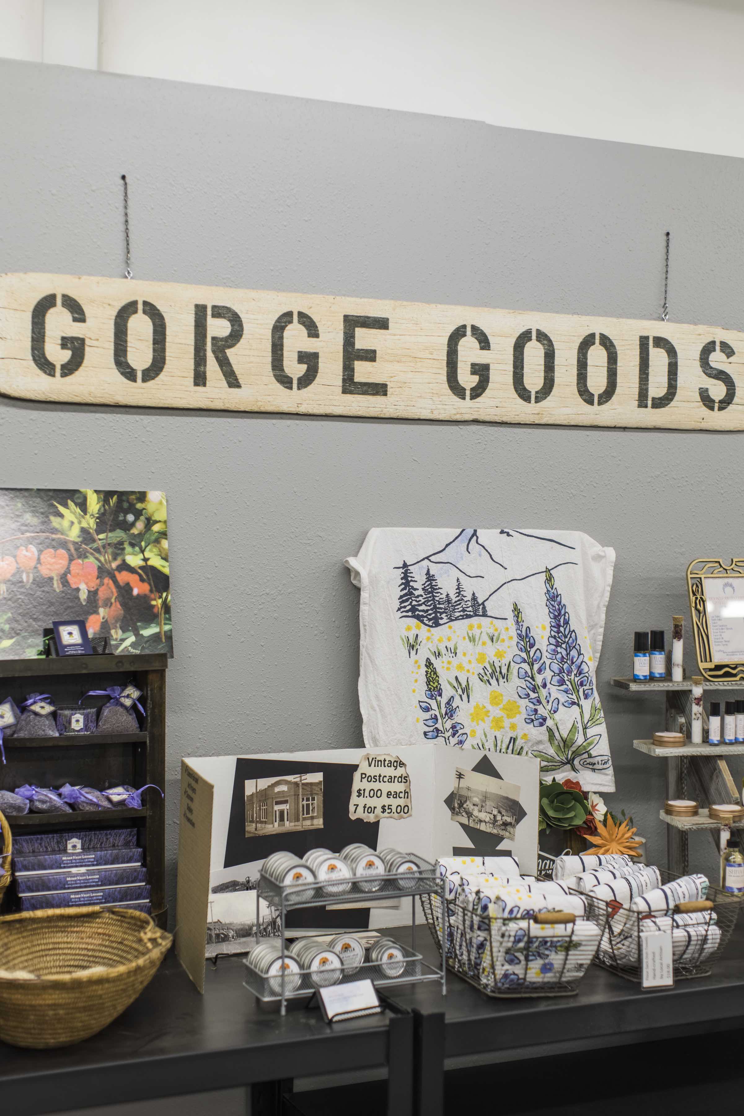 Gorge Goods sign with assortment of local towels, stickers and gifts