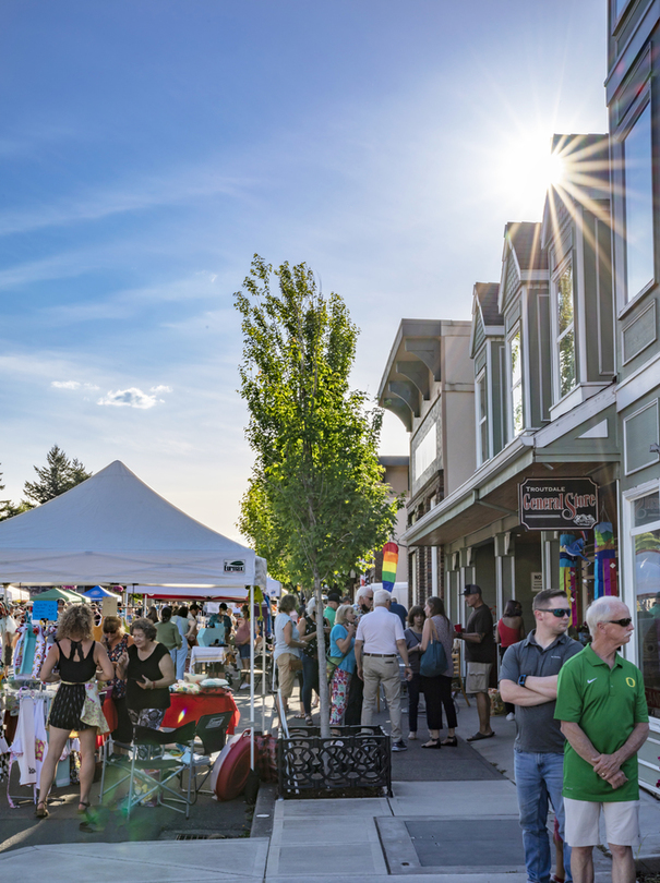 Many people attend First Friday Art Walk on sunny day in Downtown Troutdale