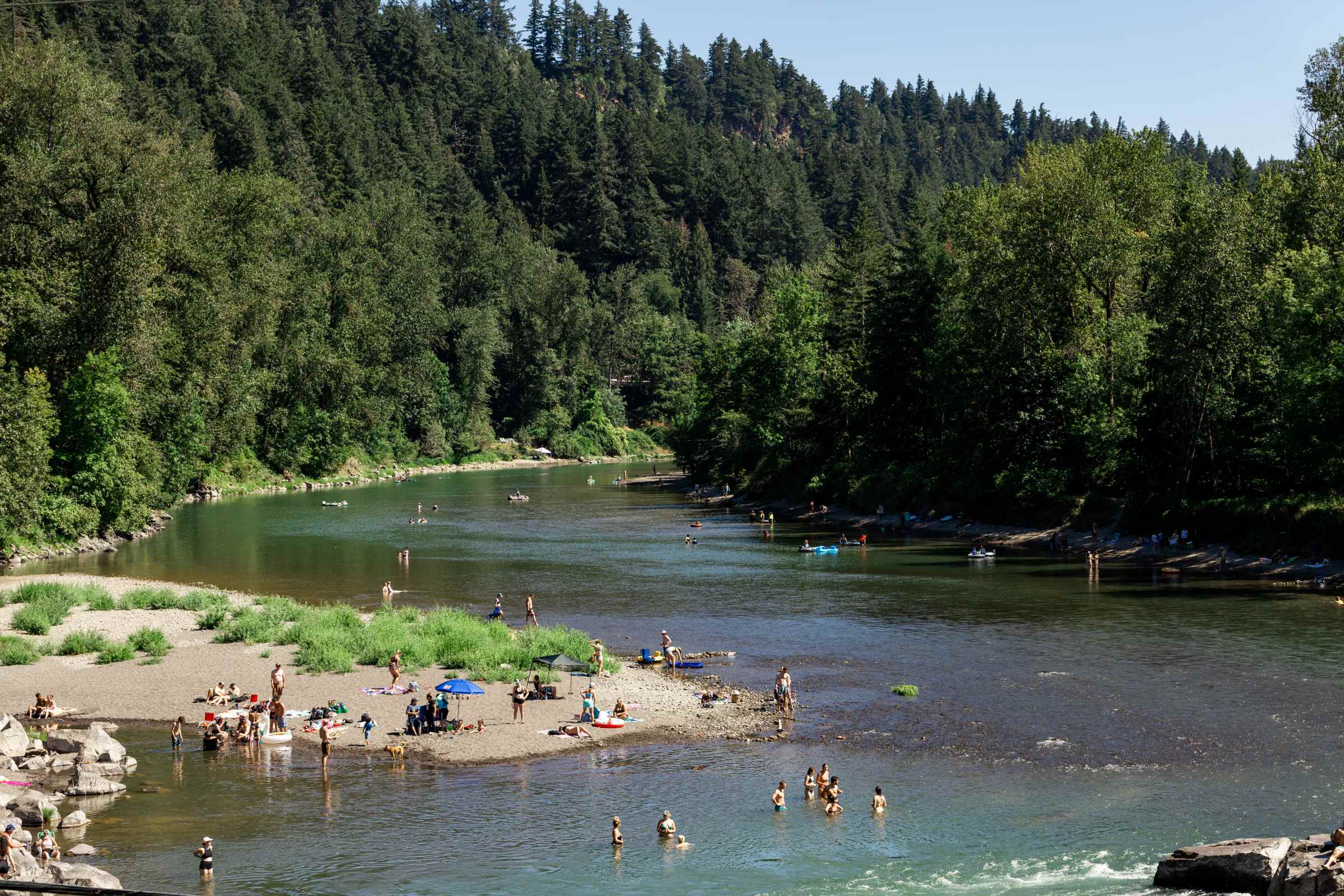 People enjoy water activities on the Sandy River at Glenn Otto Park in Troutdale