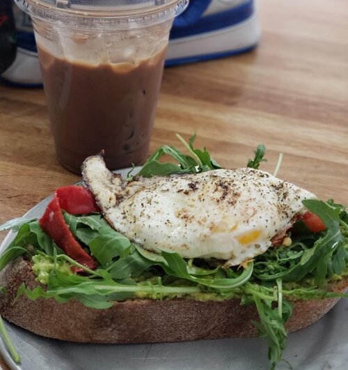 avocado toast with spinch, egg and coffee