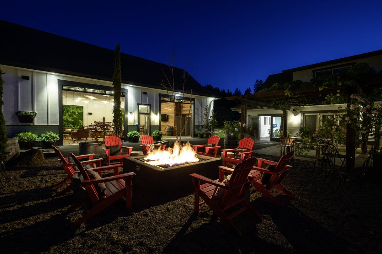 Nighttime fire ring with red chairs