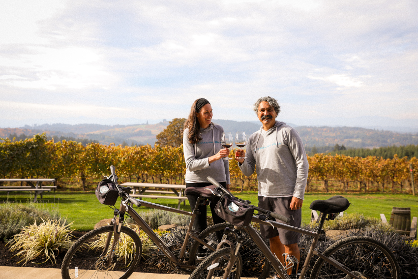 Two with wine and bikes at winery