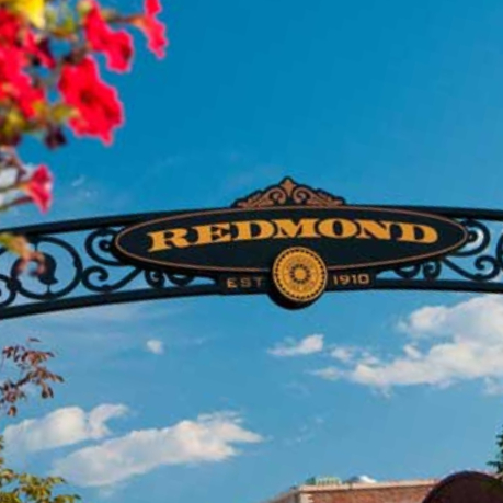 photo of old downtown redmond sign with blue skies in the background