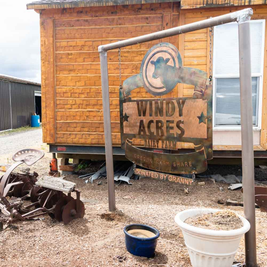 Iron signage with windy acres logo