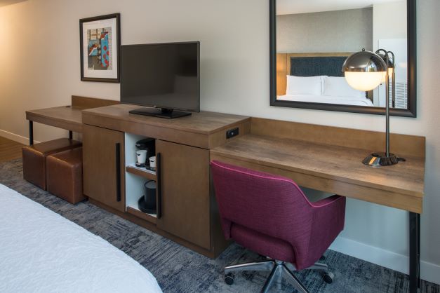 desk and tv area of hotel guest room