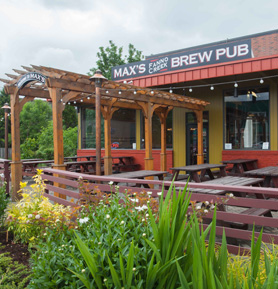 Max's Brew Pub entrance with outdoor seating.