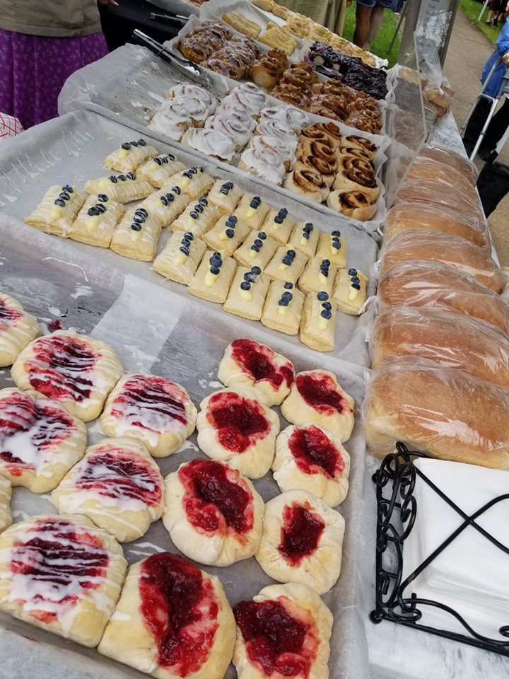 Different type of pastries lined up for sale.