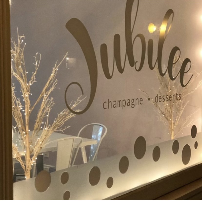 Jubilee Champagne and Dessert Bar sign.