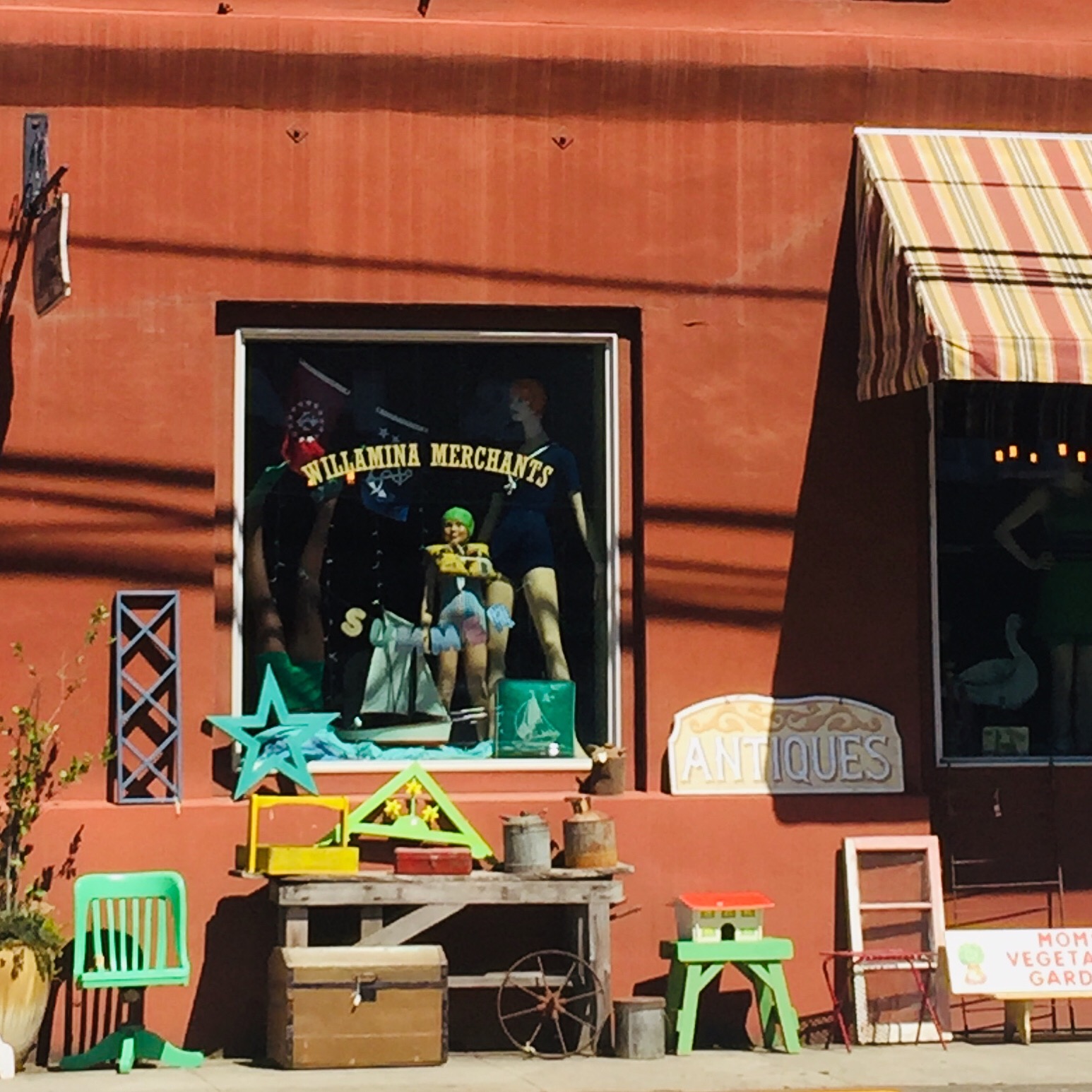 A picture of Willamina Merchants store front with decorations outside.