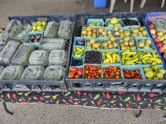 Blackberries and other produce for sale.