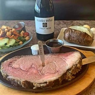 A prime rib dinner with wine from The Point Restaurant.
