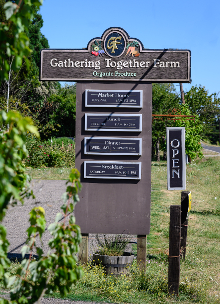 The road side sign for Gathering Together Farm.