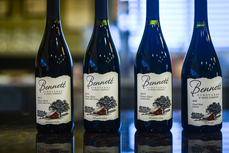 four bottles of Bennett Vineyards wine lined up.
