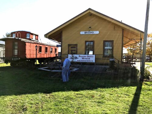 exterior one story building with caboose next to it
