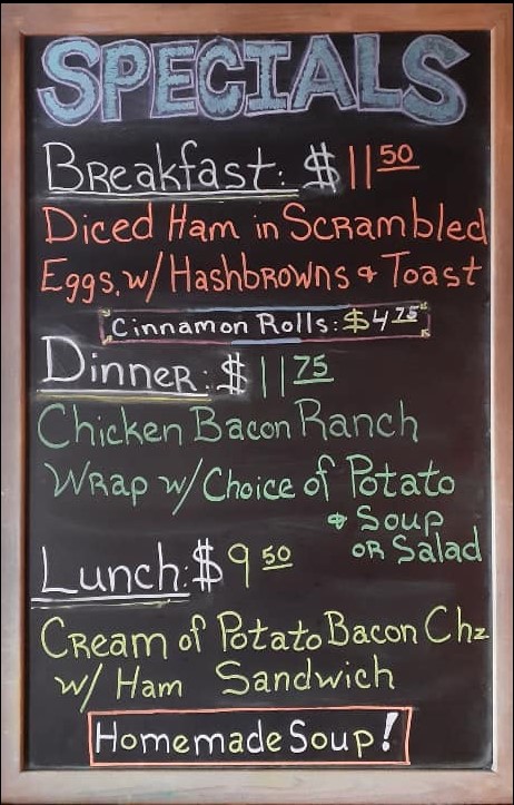 breakfast, lunch and dinner specials written on chalkboard menu