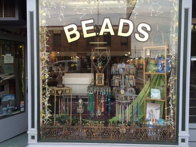 Shop Window with the word beads painted on it