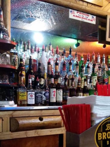 bottles of liquor and spirits behind a bar