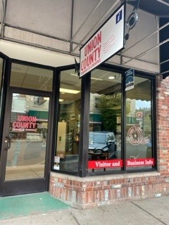 storefront with tall windows and a sign for Union County Chamber of Commerce
