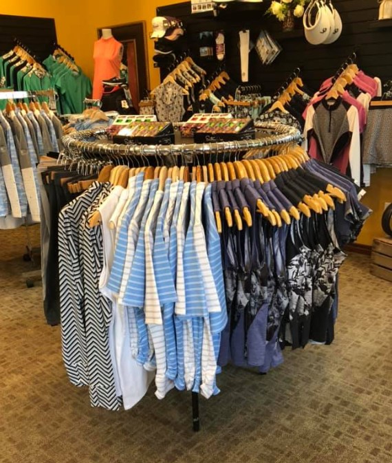 rack of apparel at golf course pro shop