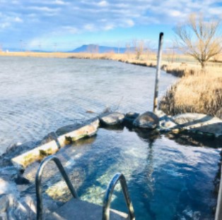 Enjoy a soak with mountain views at The Lodge at Hot Lake Springs