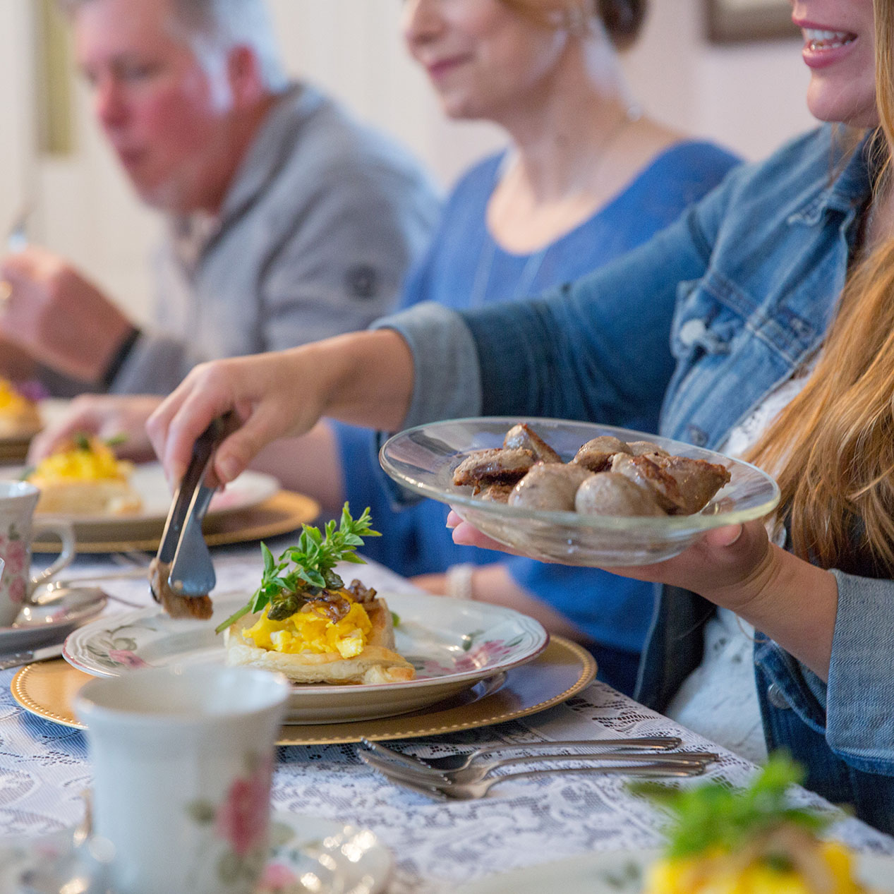People putting food on their plates at the Mother's Day Brunch at Heceta Head