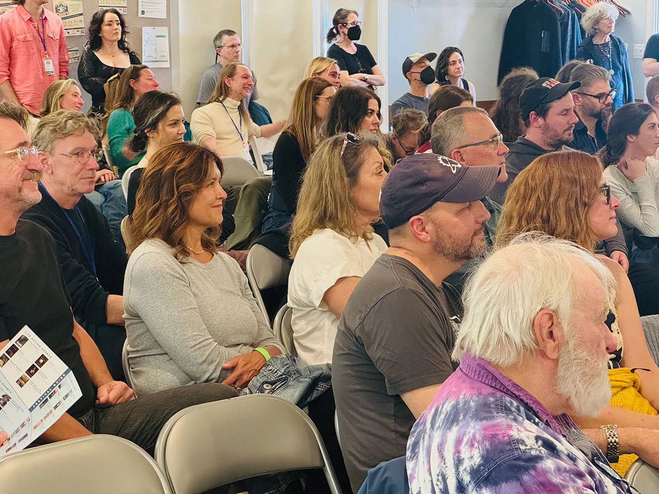 guests in audience listen to filmmakers speaking about their project at the 2025 Manzanita Film Festival