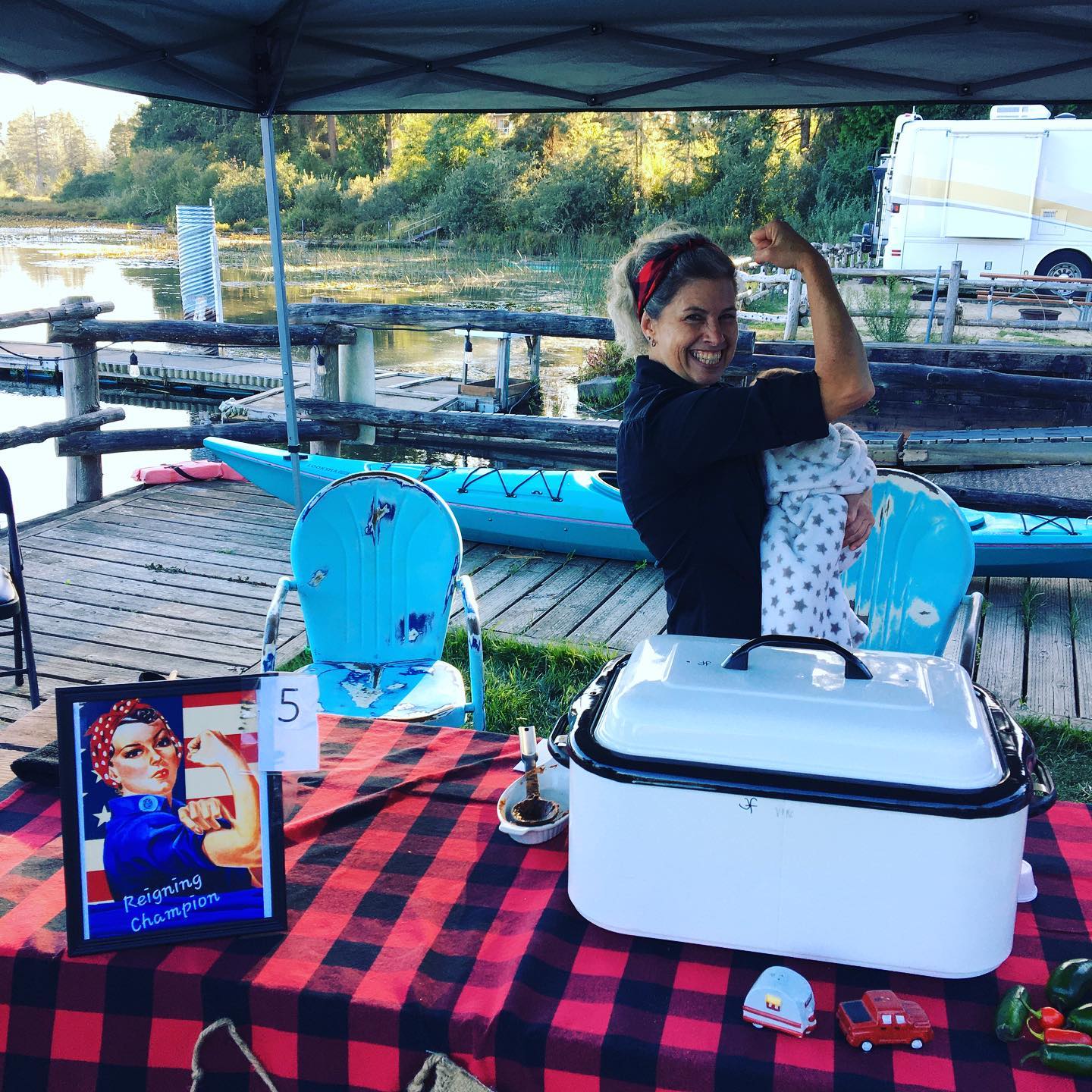 Darlings Resort Annual Chili Cook-off winner posing on dock under tent