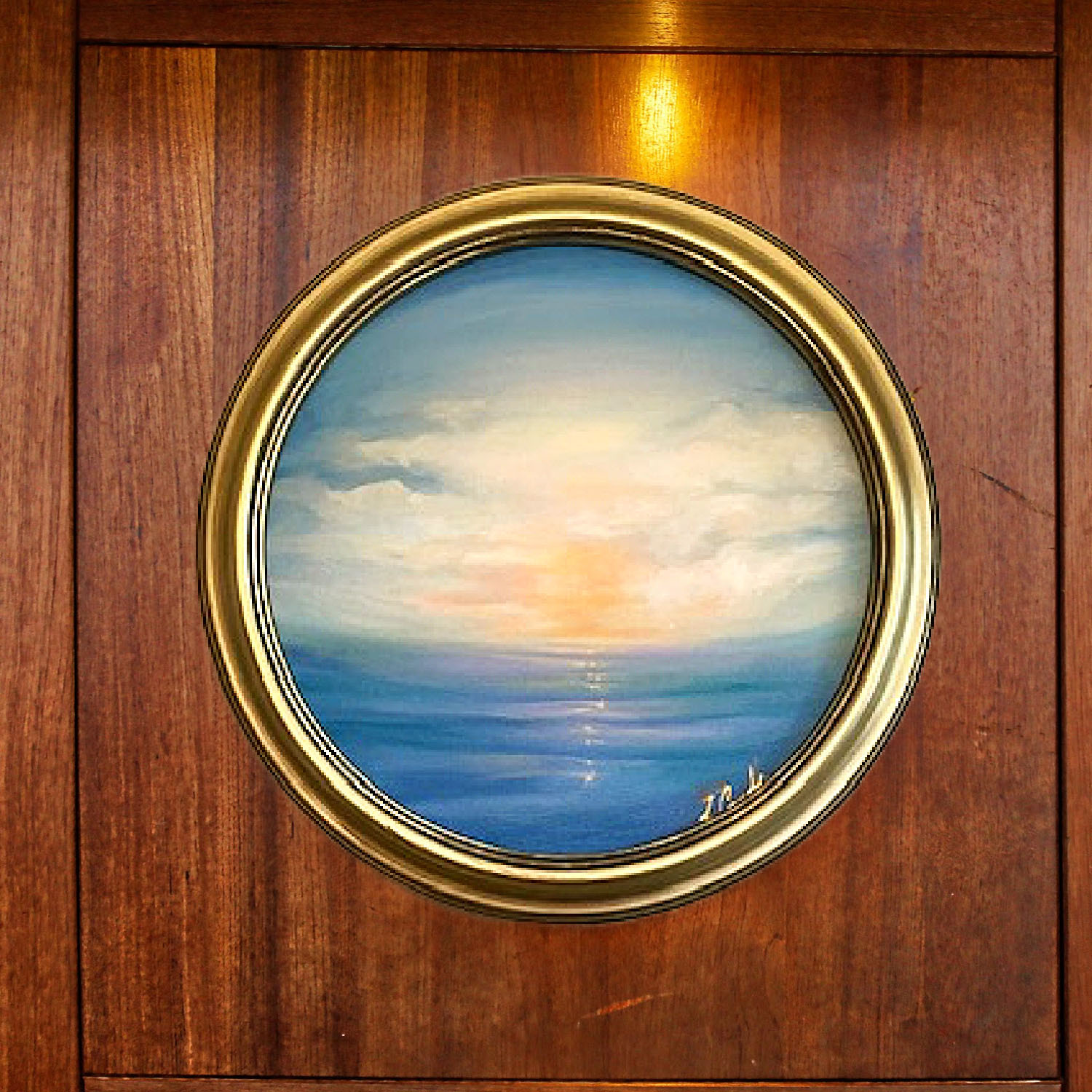 de Camille Schectmna porthole art on wood wall