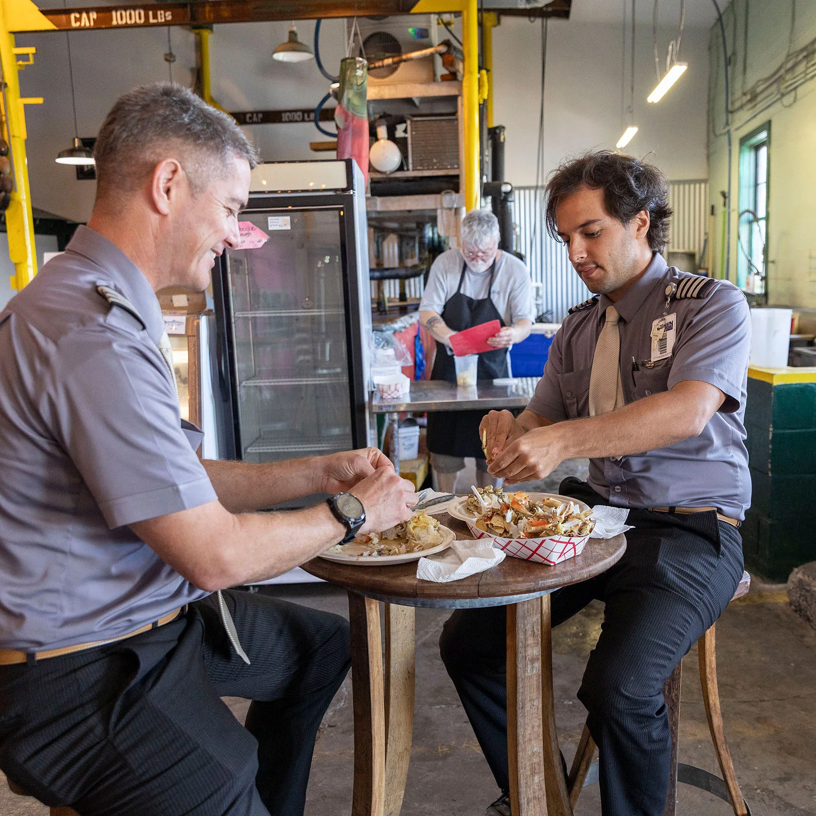 Guests enjoying local Dungeness crab, cooked fresh, at OleBob_s Seafood Market.jpg