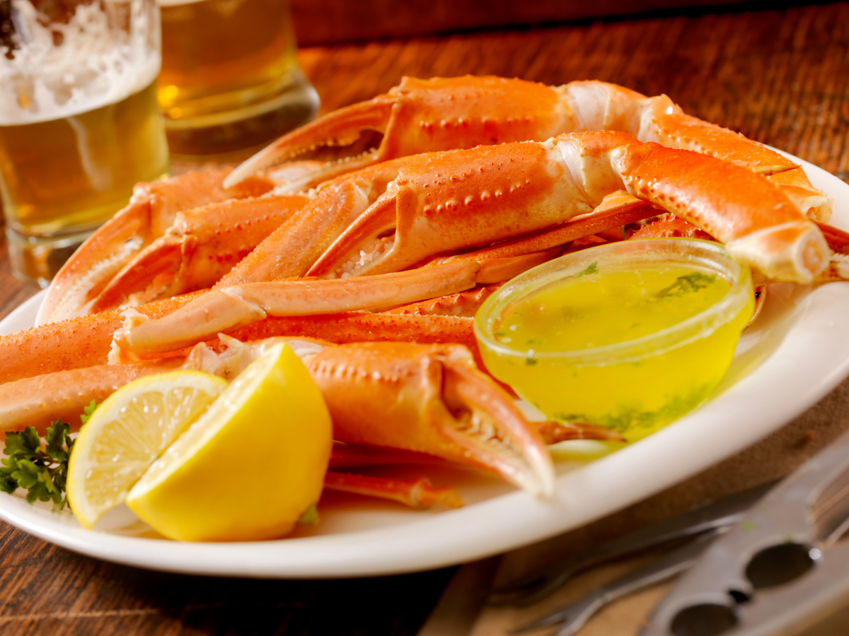 Closeup of plate of crab claws with beer on table at Chinook Winds Casino