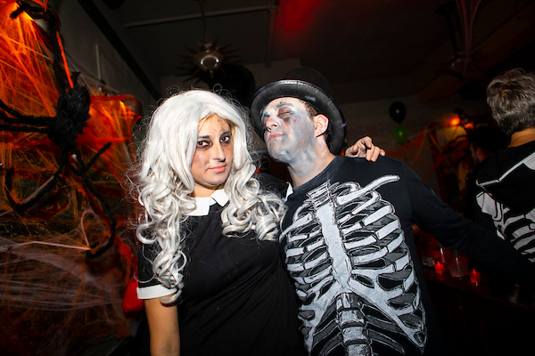 Couple posing at Spells and Shells with DJ Gregarious Halloween party