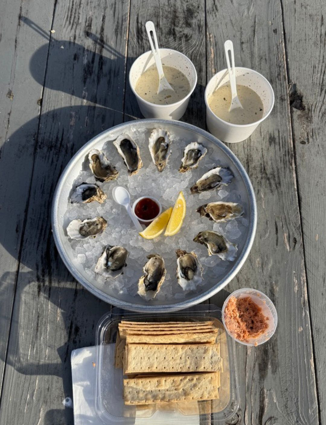 Assorted appetizers on wooden table outside