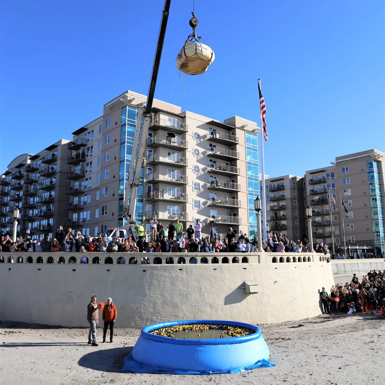 Halloween Happenin's pumpkin drop from crane into swimming pool on the beach