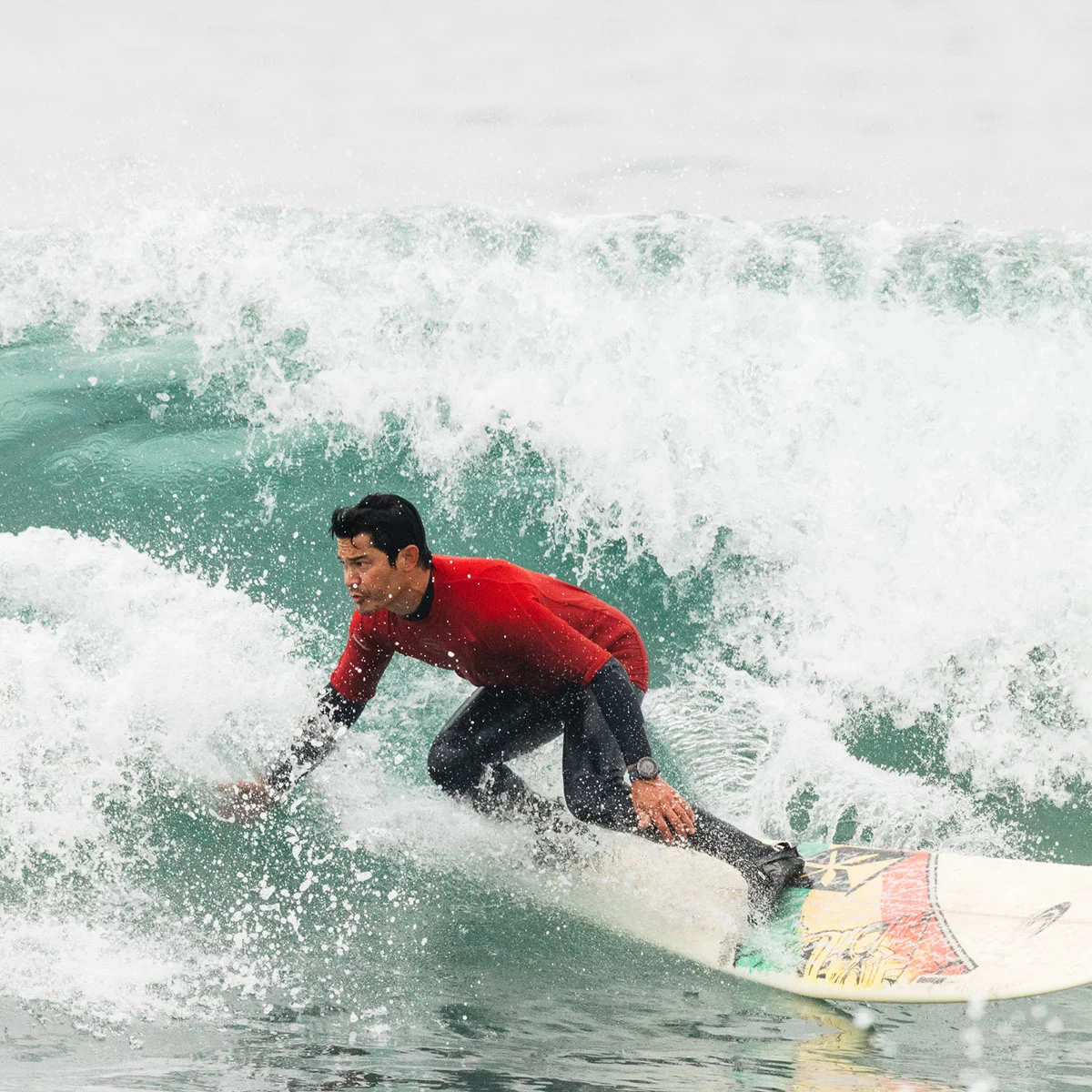 surfer surfing on big wave at Cape Kiwanda Longboard Classic