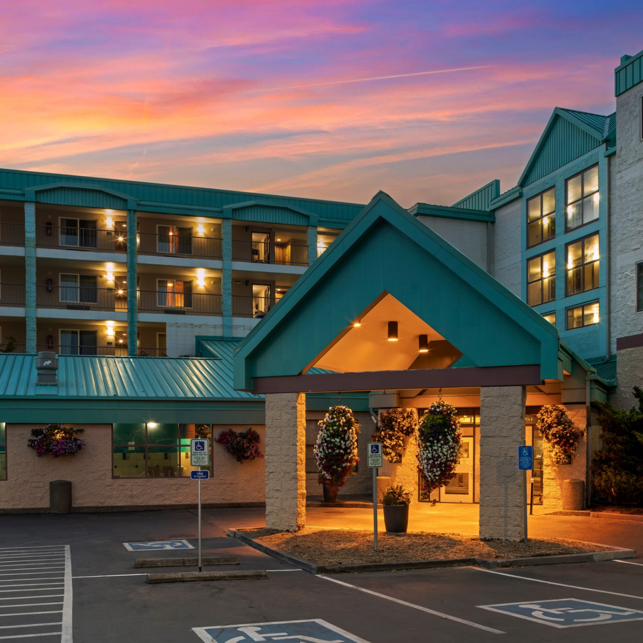 Best Western Plus Ocean View Resort exterior parking lot at dusk