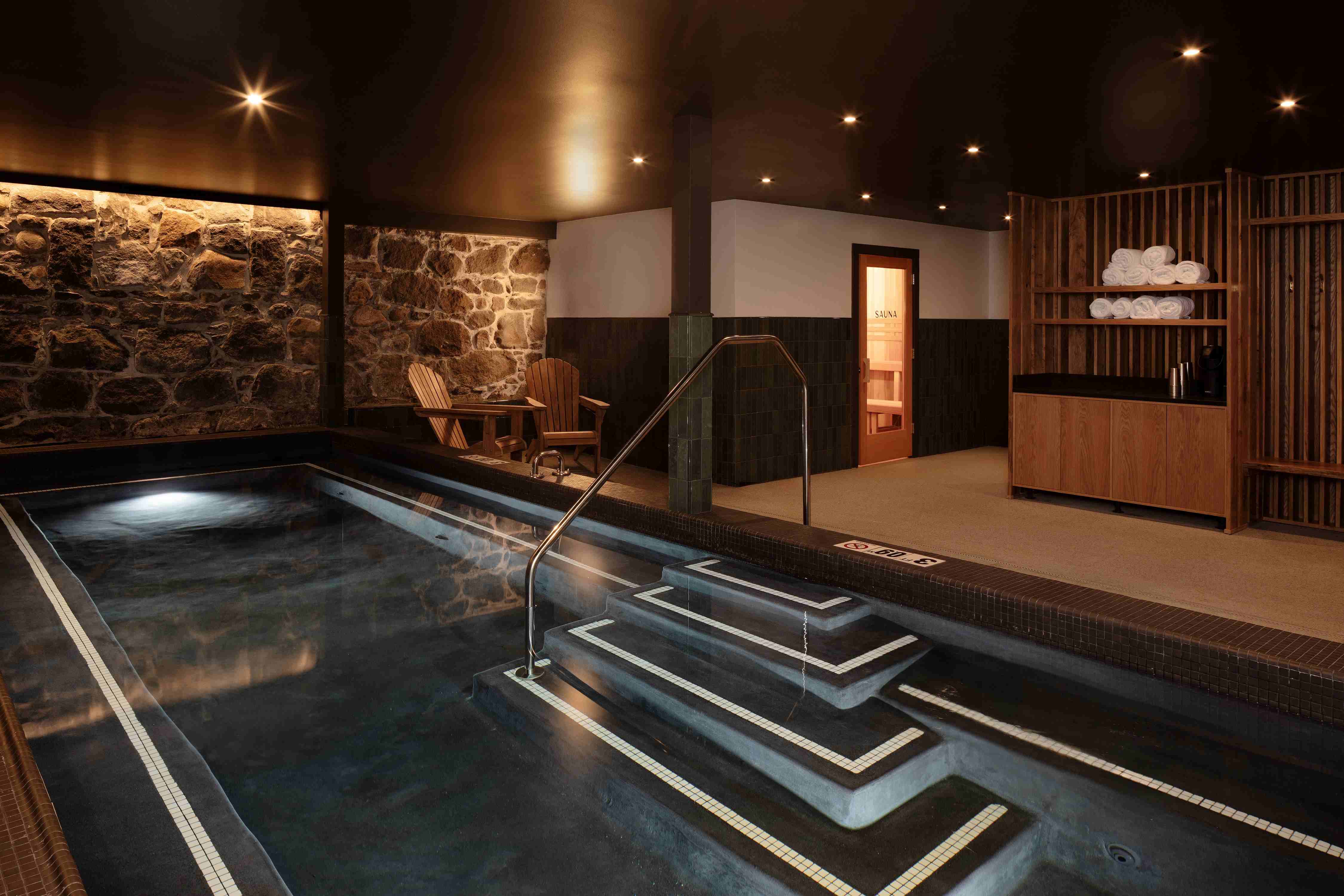 Hotel pool with dark tile.