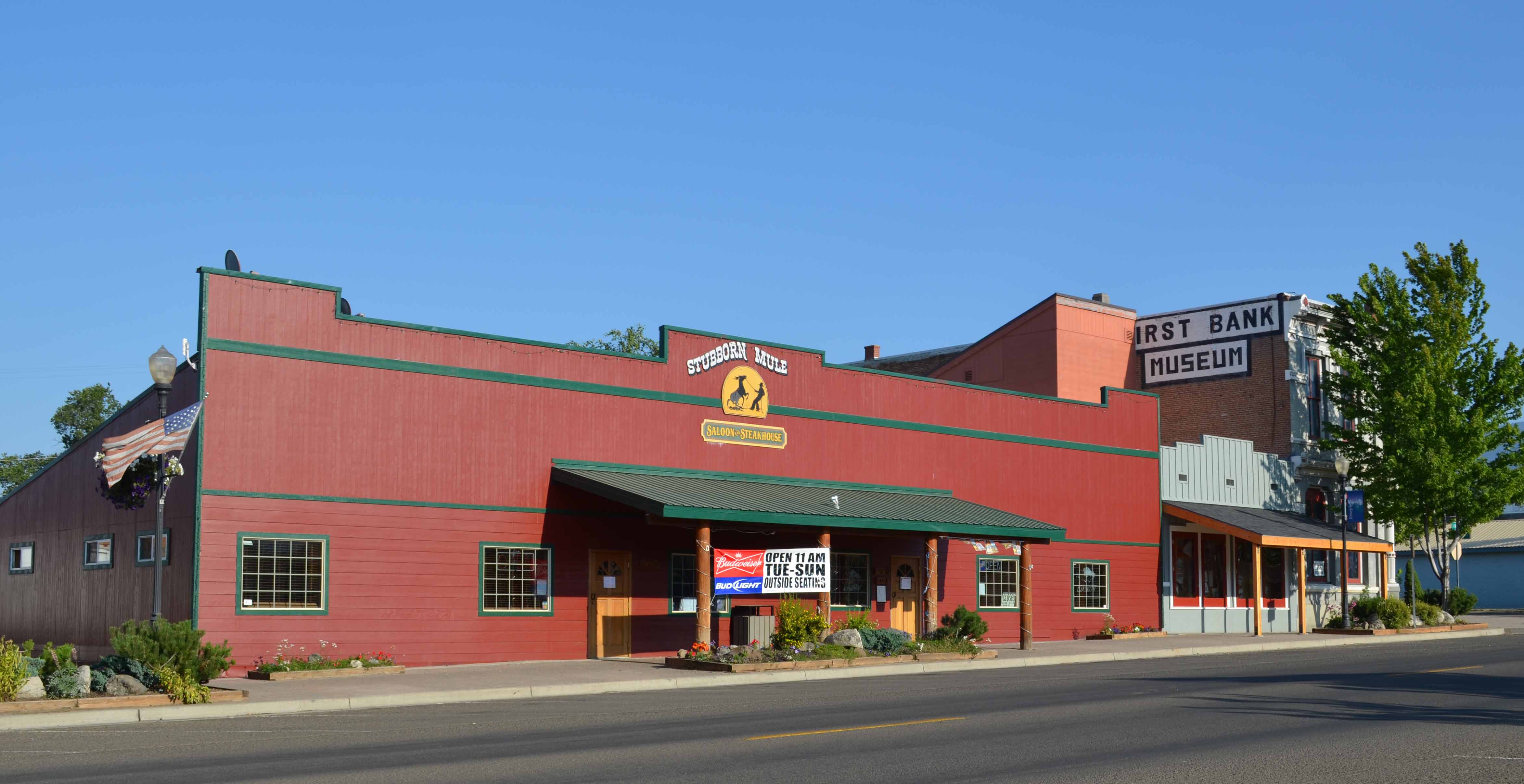 exterior of one story building with sign for Stubborn Mule Saloon & Steakhouse