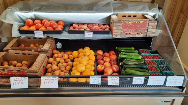 two tiered cooler display of produce