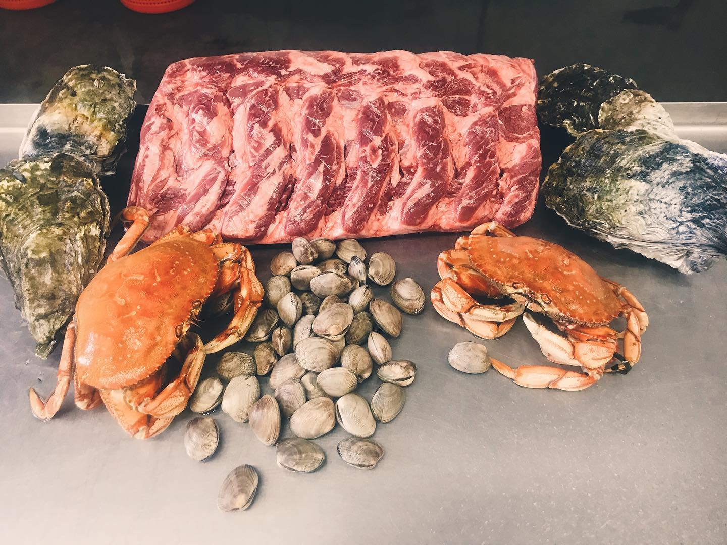 Fresh oysters, uncut beef ribs, fresh clams, and fresh dungeness crab.