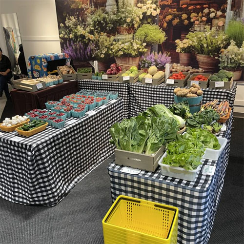 Produce displayed on tables inside Troutdale Farm Market