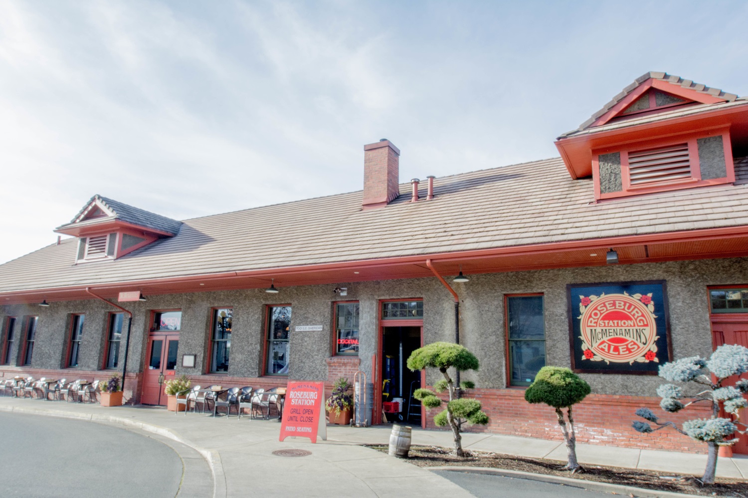 Front view with outside seating and trees