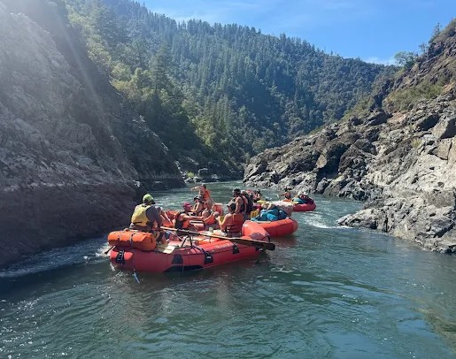 People in rafting boats on a river