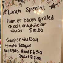 Lunch special menu featuring grilled cheese and soup of the day
