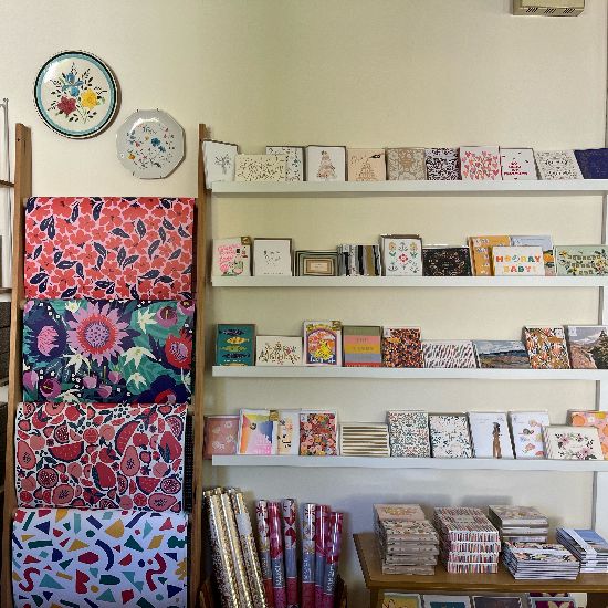 cards and wrapping paper displayed inside home goods vintage store