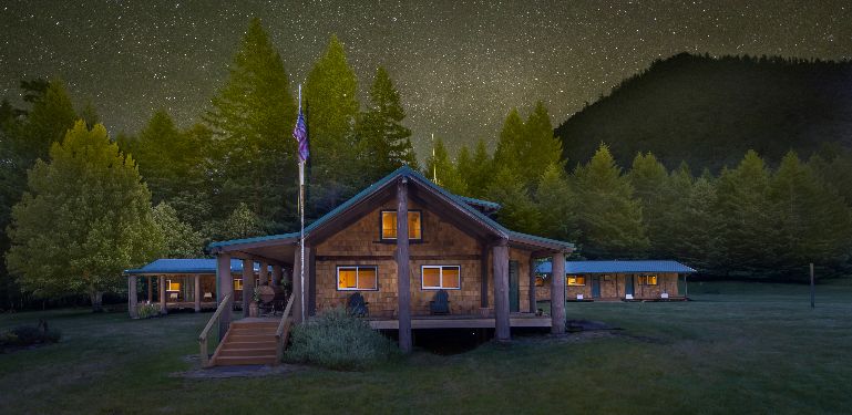 exterior of cabin under starry sky