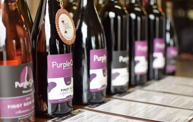 Bottles of Purple Cow wines with awards