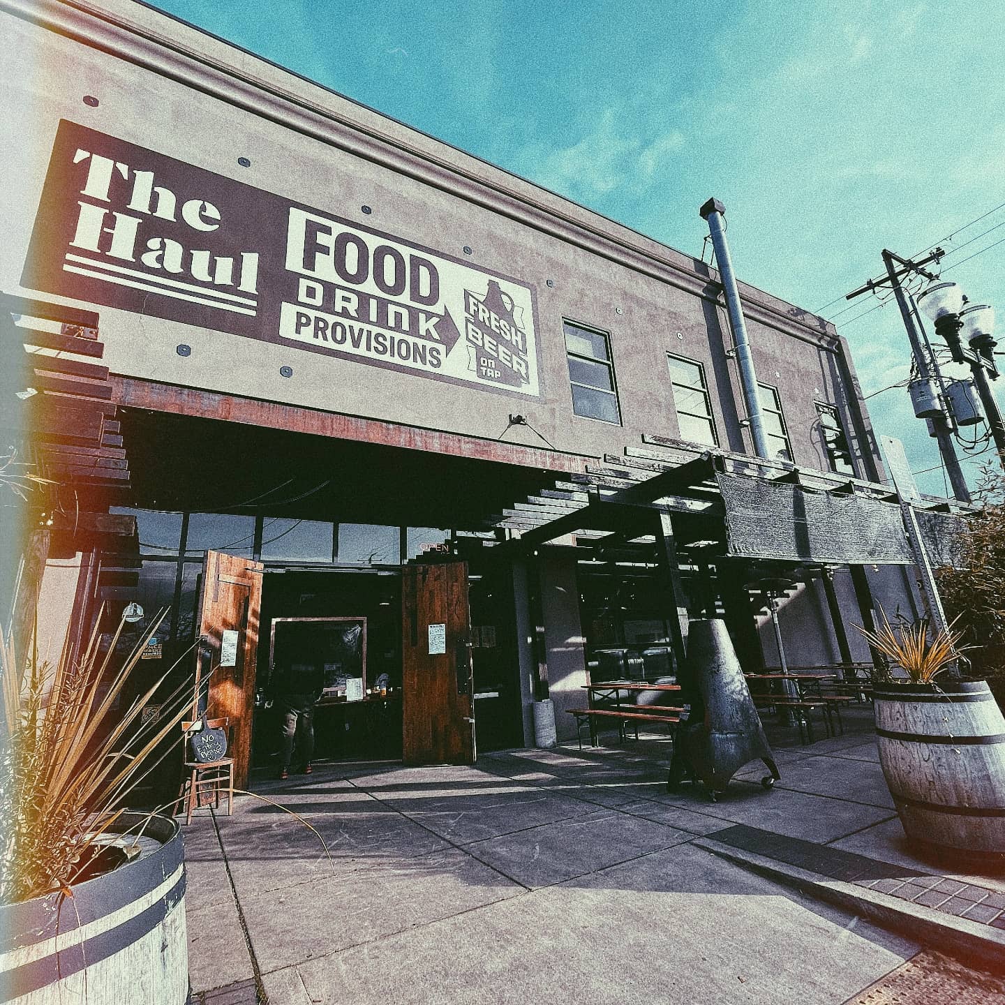 storefront of restaurant with sign for The Haul restaurant