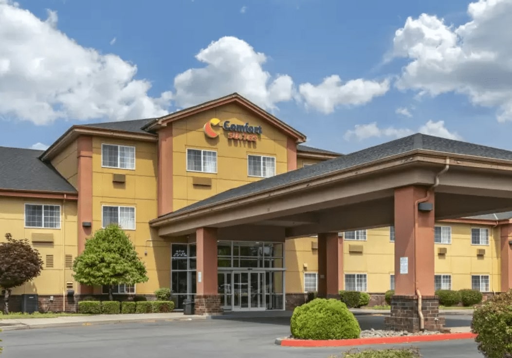 exterior of multi story hotel with lettering for Comfort Suites
